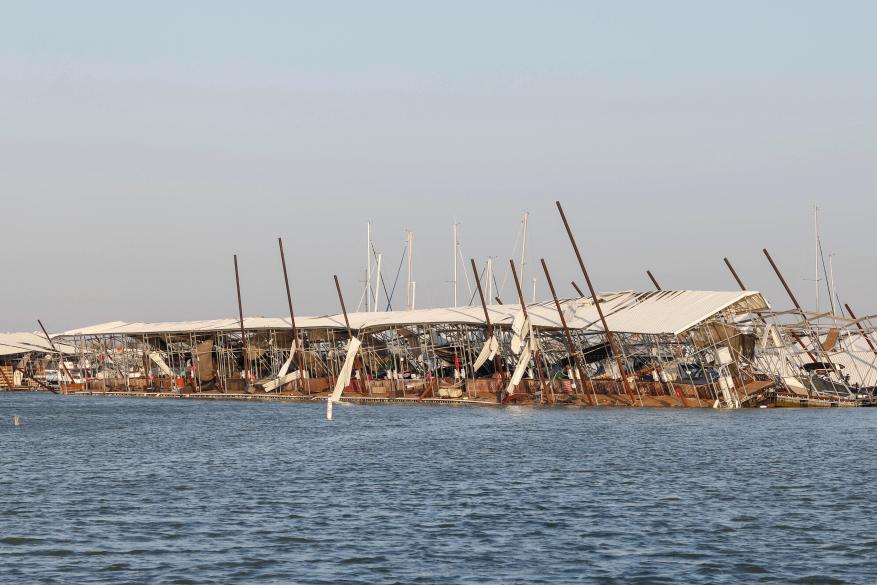 Docks and boats are damaged at Lake Lewisville marina following the storms in Lewisville, Texas on March 3, 2023.