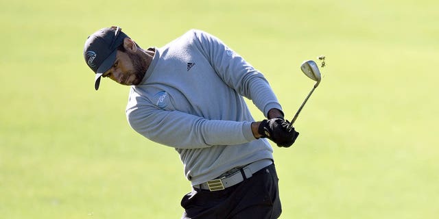 Aaron Rai of England plays his shot on the fourth green of the South Course during the second round of the Farmers Insurance Open at Torrey Pines Golf Course on January 26, 2023, in La Jolla, California. 