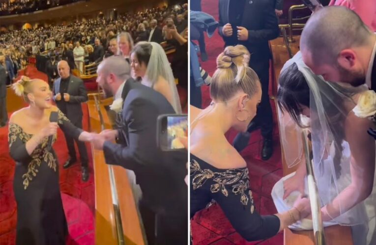 Adele signs newlyweds’ wedding dress after attending concert