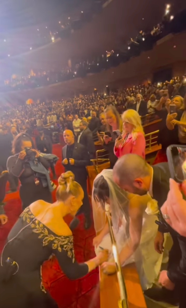 The video, which was taken during Adele's residency at Caesar's Palace in Las Vegas, shows the singer walking around the audience -- while singing “When We Were Young”--  before spotting the newlyweds.