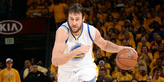 Andrew Bogut #12 of the Golden State Warriors drives against the Houston Rockets in Game Two of the Western Conference Finals of the 2015 NBA Playoffs on May 21, 2015 at Oracle Arena in Oakland, California.