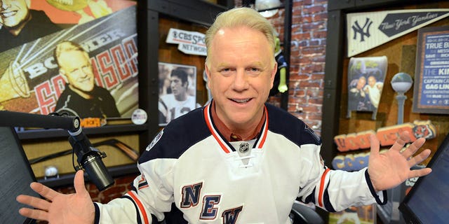 Boomer Esiason wearing a New York Rangers jersey on his radio show at the WFAN studio in New York.