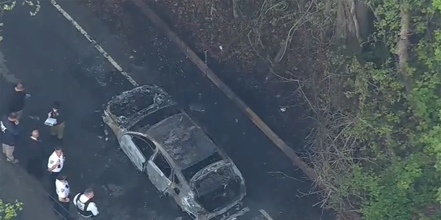 The NYPD said two homicide victims were found in burning car. 