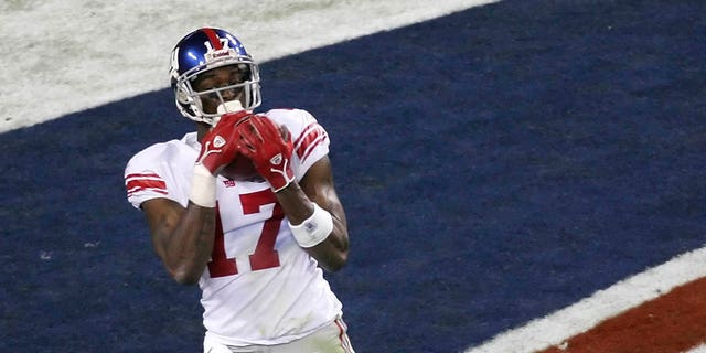 Wide receiver Plaxico Burress of the New York Giants catches a 13-yard touchdown pass in the fourth quarter against the New England Patriots during Super Bowl XLII Feb. 3, 2008, at the University of Phoenix Stadium in Glendale, Ariz. The Giants defeated the Patriots 17-14. 