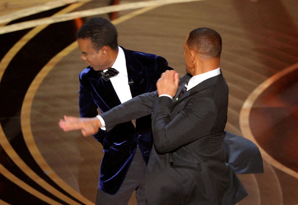 Will Smith hits Chris Rock onstage during the 94th Academy Awards i