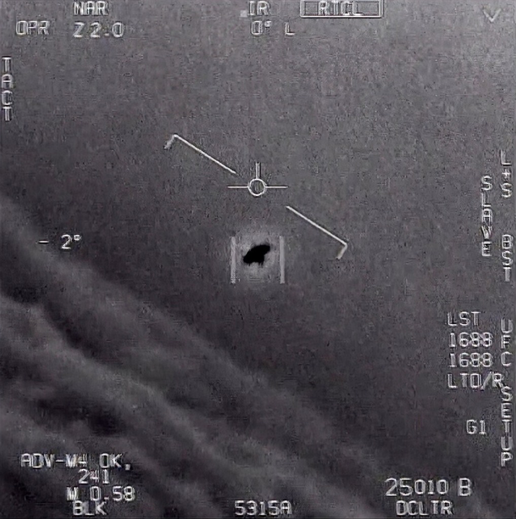 A video screenshot shows an unexplained aerial object observed by U.S. military personnel.
