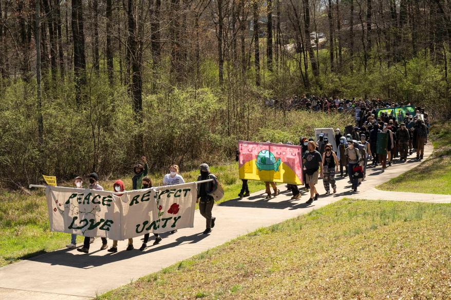 Protesters march near the construction of the police training facility on March 4, 2023 in Atlanta, Ga.