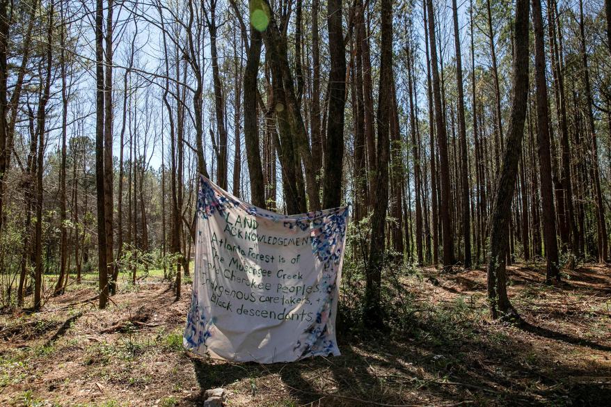 A banner is displayed along the South River Trail near the site where the proposed Atlanta public safety training center will be constructed in Atlanta, Ga., on March 4, 2023.