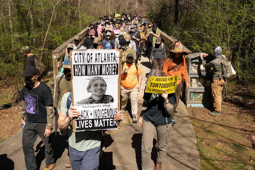 Hundreds of people marched to protest the construction of a large police training facility dubbed 'Cop City' in an Atlanta forest on March 4, 2023.