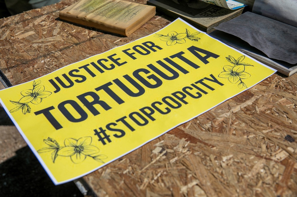 A protest sign for Manuel "Tortuguita" Paez Teran, a man killed by police officers near the proposed building site for the Atlanta public training facility, is displayed along the South River Trail on March 4, 2023. 