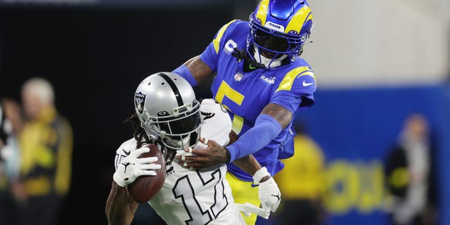 Davante Adams #17 of the Las Vegas Raiders makes a reception against Jalen Ramsey #5 of the Los Angeles Rams during the first quarter at SoFi Stadium on December 08, 2022 in Inglewood, California.