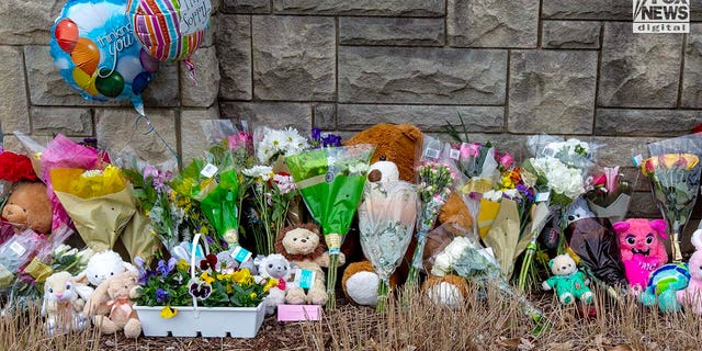 Memorials for the six victims who were killed in a mass shooting are placed outside of The Covenant School in Nashville, Tennessee on Tuesday, March 28, 2023. On Monday, three adults and three children were killed inside the school.