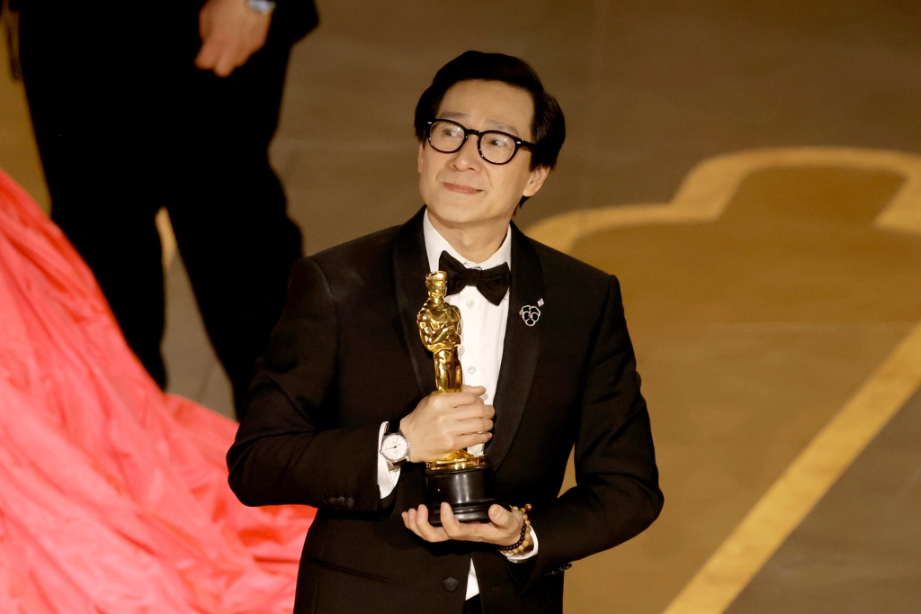 Ke Huy Quan accepts the Best Picture award for "Everything Everywhere All at Once" onstage during the 95th Annual Academy Awards at Dolby Theatre on March 12, 2023