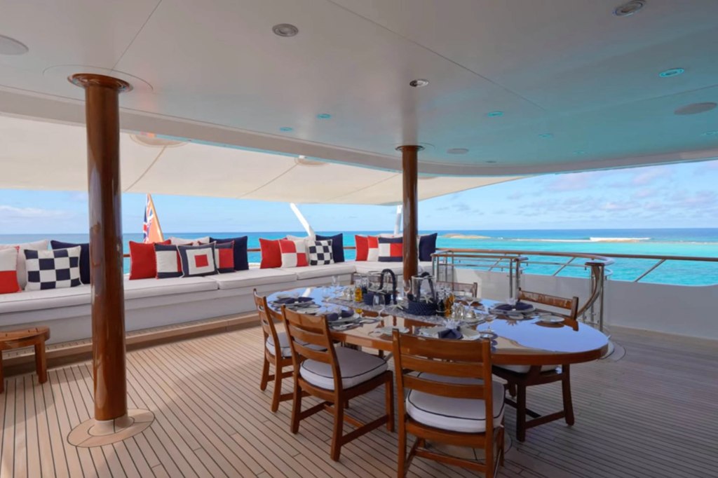 Guests can overlook the ocean as they dine on the yacht. 