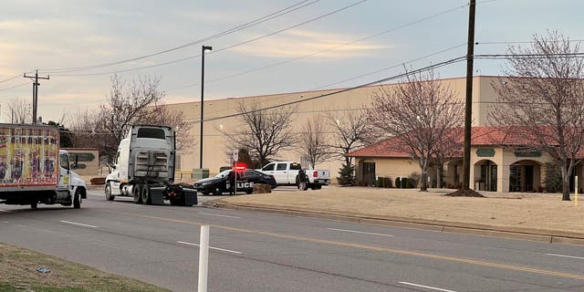 Police outside the Hobby Lobby distribution center in Oklahoma City after an employee shot, killed a manager.