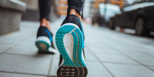 Close up shot of runner's shoes.