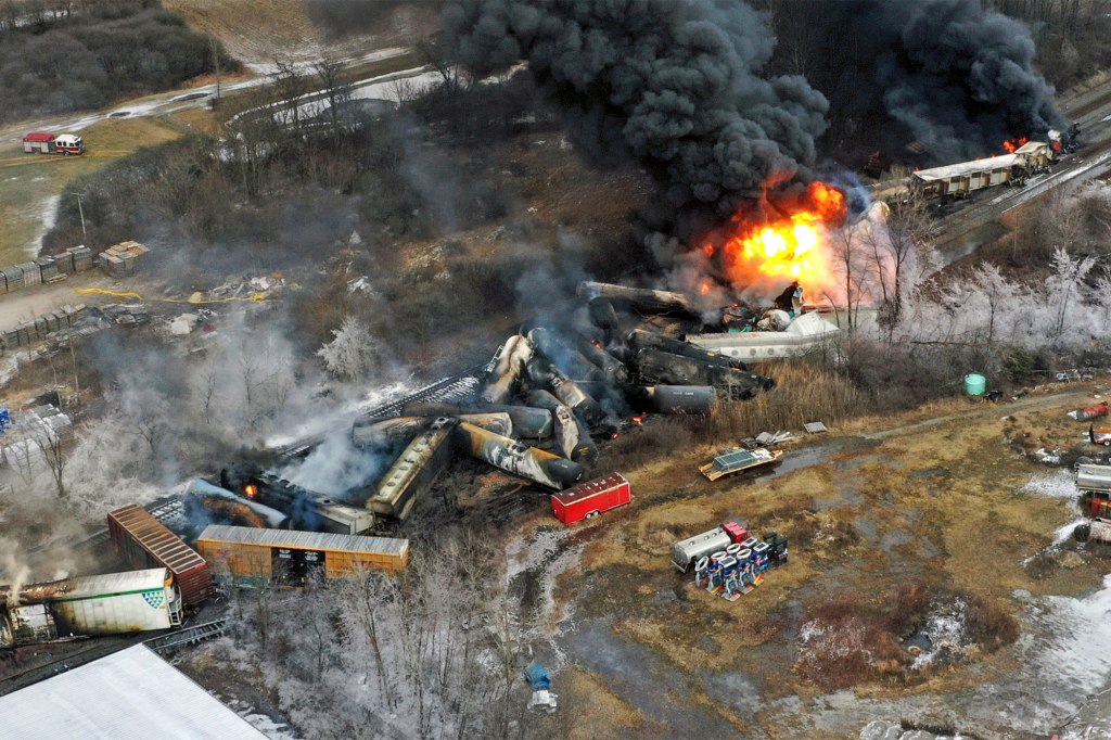 Portions of the Norfolk and Southern freight remained on fire on Saturday, Feb. 4, a day after the derailment. 