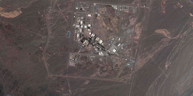 This satellite image from Planet Labs PBC shows Iran's underground Natanz nuclear site, as well as ongoing construction to expand the facility in a nearby mountain to the south, near Natanz, Iran, May 9, 2022.