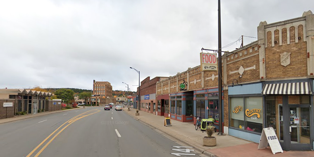 Street in Iron Mountain, Michigan, with town's visitor center seen in distance.