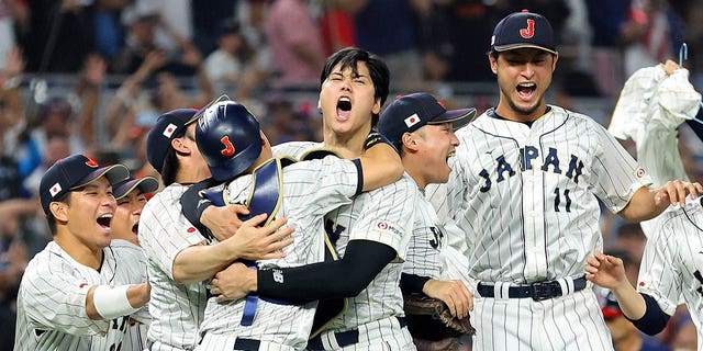 Team Japan celebrates after the final out of the World Baseball Classic Championship defeating Team USA 3-2 at loanDepot park on March 21, 2023, in Miami, Florida. 