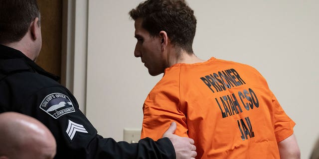 Bryan Kohberger, right, who is accused of killing four University of Idaho students in November 2022, is led away following a hearing in Latah County District Court, Thursday, Jan. 5, 2023, in Moscow, Idaho. 