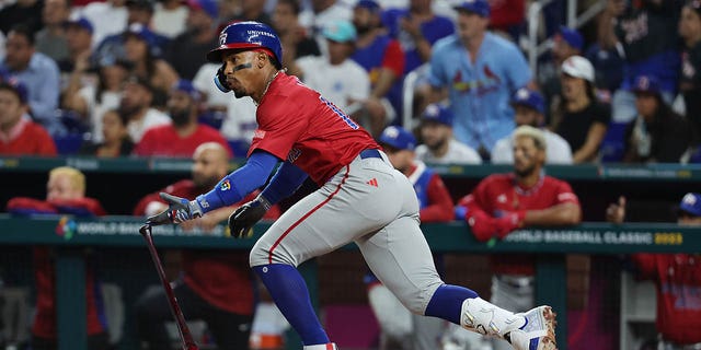 Francisco Lindor #12 of Team Puerto Rico singles in a run in the third inning against Team Dominican Republic during their World Baseball Classic Pool D game at loanDepot park on March 15, 2023 in Miami, Florida.