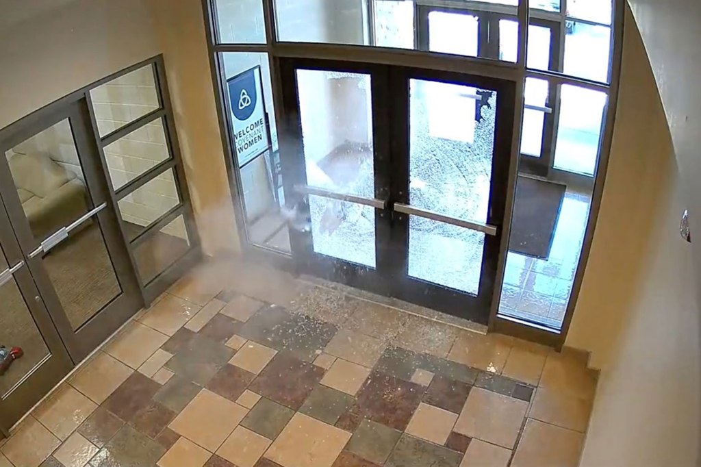 The shooter made entry into the school by shooting through a side door.