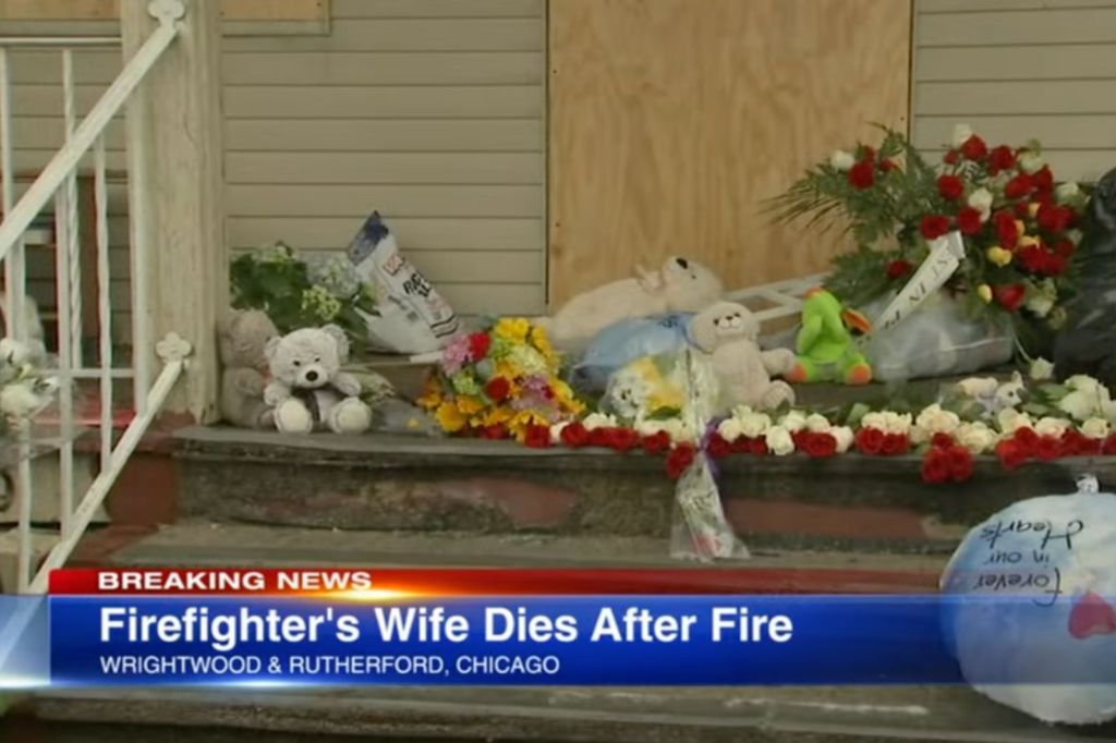 Flowers are left at the front of the family's doorstep to honor the victims.