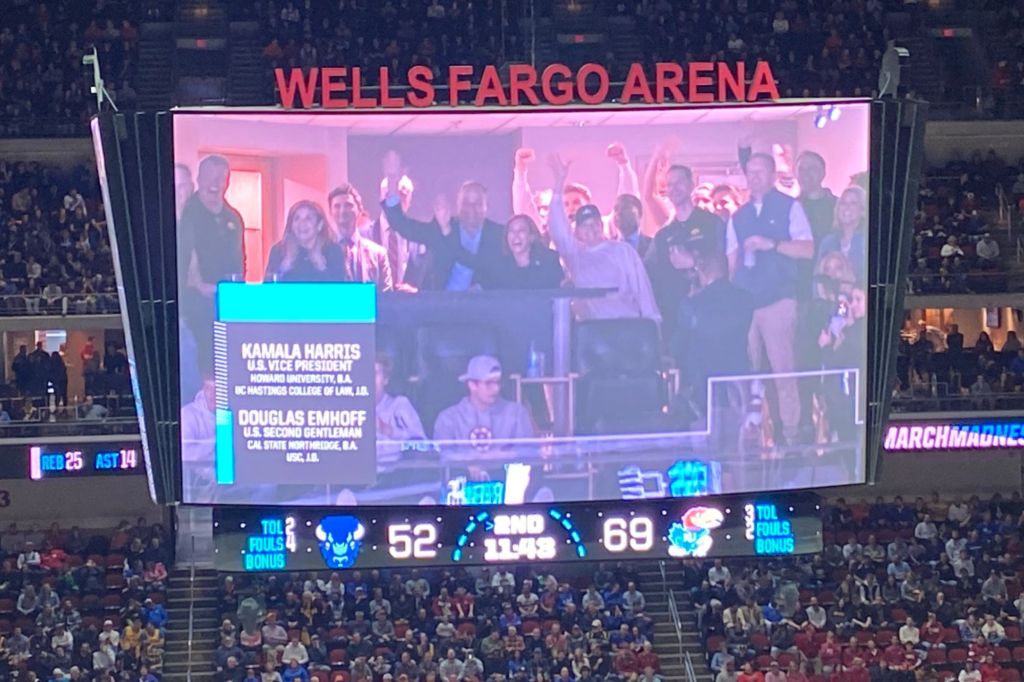 Vice President Kamala Harris is seen waving as she's displayed on the big screen during the game between the Howard Bison and Kansas Jayhawks at Wells Fargo Arena on March 16, 2023.  