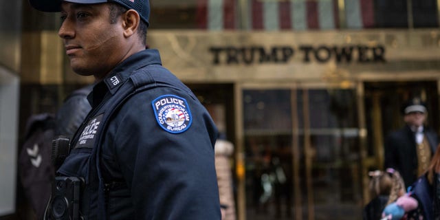 A police officer stands in front of Trump Tower in New York, New York on March 22, 2023. -
