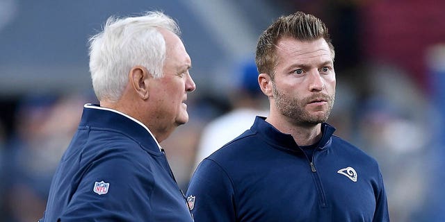 Head coach Sean McVay of the Los Angeles Rams, right, talks with defensive coordinator Wade Phillips before a game against the Baltimore Ravens at Los Angeles Memorial Coliseum Nov. 25, 2019, in Los Angeles.