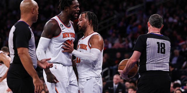 The Knicks' Jalen Brunson (11) holds back Julius Randle (30) as Randle argues with a referee after being ejected during the third quarter of a game against the Sacramento Kings at Madison Square Garden Dec. 11, 2022. 