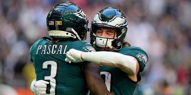 Philadelphia Eagles wide receiver Zach Pascal (3) embraces tight end Jack Stoll before the NFL Super Bowl LVII football game between the Kansas City Chiefs and the Philadelphia Eagles, Sunday, Feb. 12, 2023, in Glendale, Ariz. 