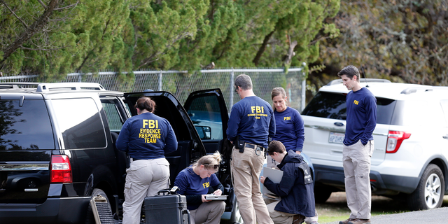 FBI investigators at Rancho Tehama Elementary School in the small community of Rancho Tehama, California, where a gunman killed several people earlier this morning on Tuesday Nov. 14, 2017, in Corning, California.