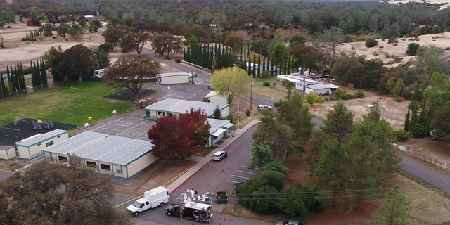 FBI investigators, foreground center, gather evidence at the Rancho Tehama Elementary School in Rancho Tehama Reserve in Corning, California, on Tuesday, Nov.14, 2017.