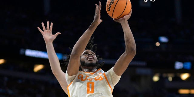 Tennessee forward Jonas Aidoo (0) goes up for a shot in front of Duke center Ryan Young during the first half of a second-round NCAA Tournament game Saturday, March 18, 2023, in Orlando, Fla. 