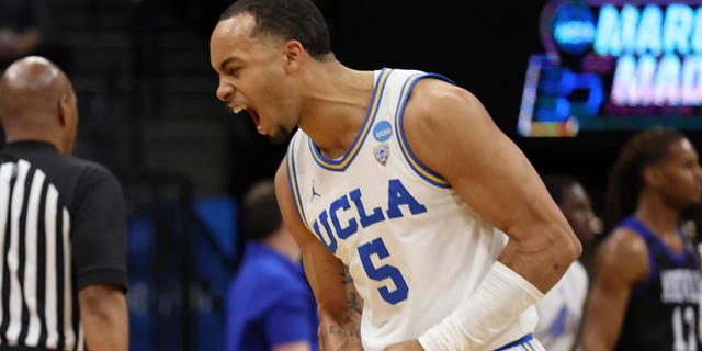 Tyger Campbell #10 of the UCLA Bruins looks on as Amari Bailey #5 of the UCLA Bruins reacts during the first half of a game North Carolina-Asheville Bulldogs in the first round of the NCAA Men's Basketball Tournament at Golden 1 Center on March 16, 2023 in Sacramento, California.