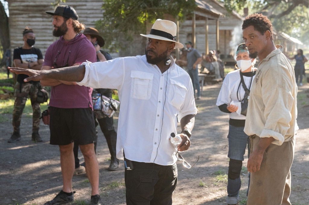 "Emancipation" director Antoine Fuqua is joined by Will Smith on the set of the 2022 film.