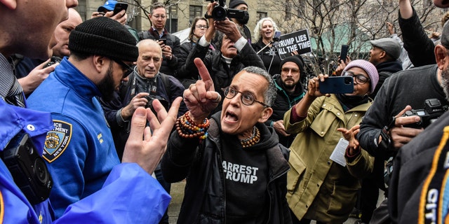 Protesters got heated in New York City as former President Trump arrived and surrendered to authorities.