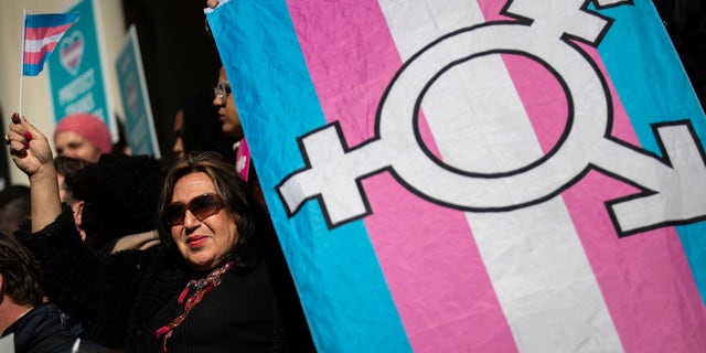 LGBT activists and their supporters rally in support of transgender people on the steps of New York City Hall, Oct. 24, 2018 in New York City.