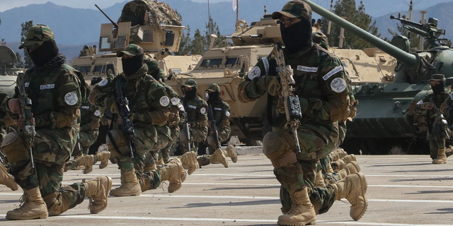 Newly recruited personnel for Taliban security forces demonstrate their skills during their graduation ceremony on Feb. 9, 2023.