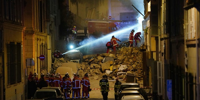 Firefighters worked Sunday to put out a fire deep within the rubble that hindered rescue efforts.