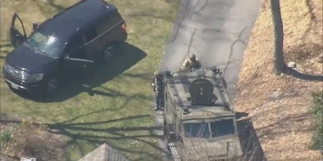 Aerial photo of the arrest of Air National Guardsman Jack Teixeira by FBI agents for allegedly leaking classified materials.