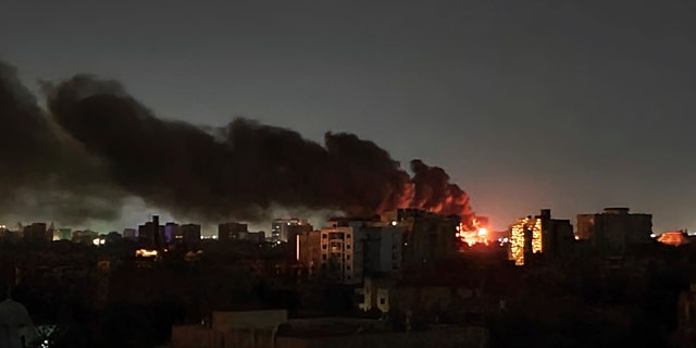 A plume of smoke at night