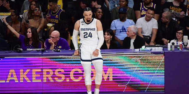 Dillon Brooks waits to check in