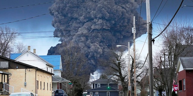 Plume of dark smoke rising from the site of the Ohio toxic train derailment