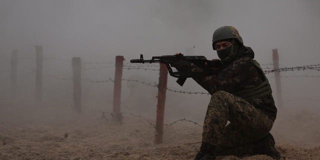 A Ukrainian soldier takes part in a military drill on psychological combat training at an undisclosed location close to the border with Belarus in Ukraine March 11, 2023. 