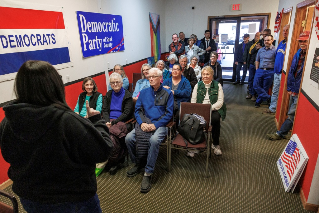Democratic volunteers meet at the Sauk County Democratic headquarters before they head out to canvass voters for Wisconsin Supreme Court candidate Janet Protasiewicz in Baraboo, Wisconsin. 