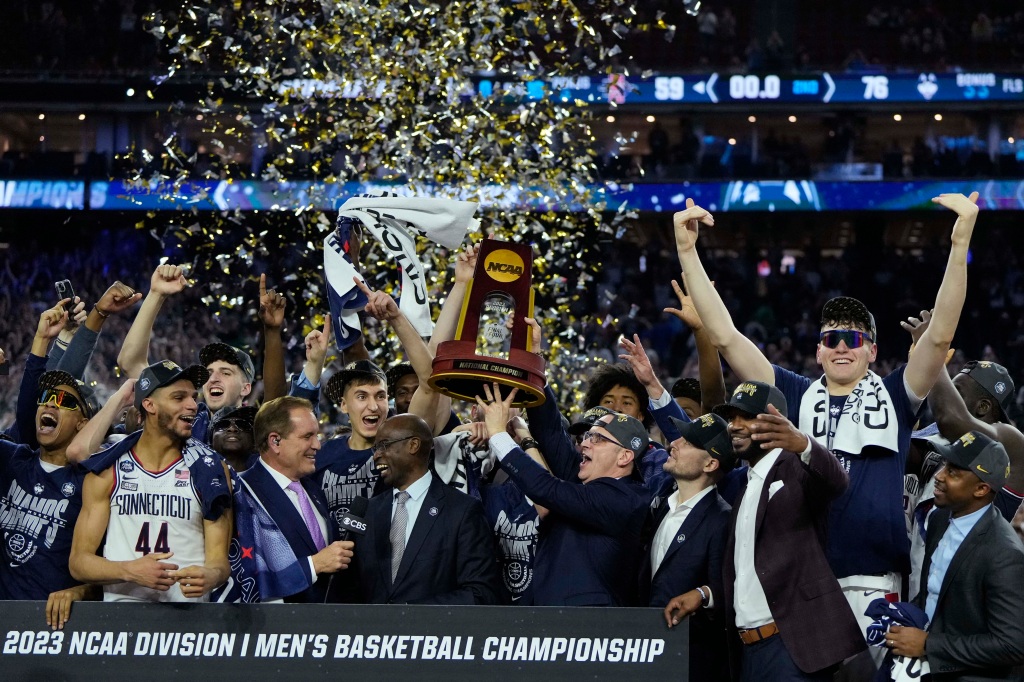 UConn players celebrate after defeating the San Diego State Aztecs in the national championship game of the 2023 NCAA Tournament at NRG Stadium. 