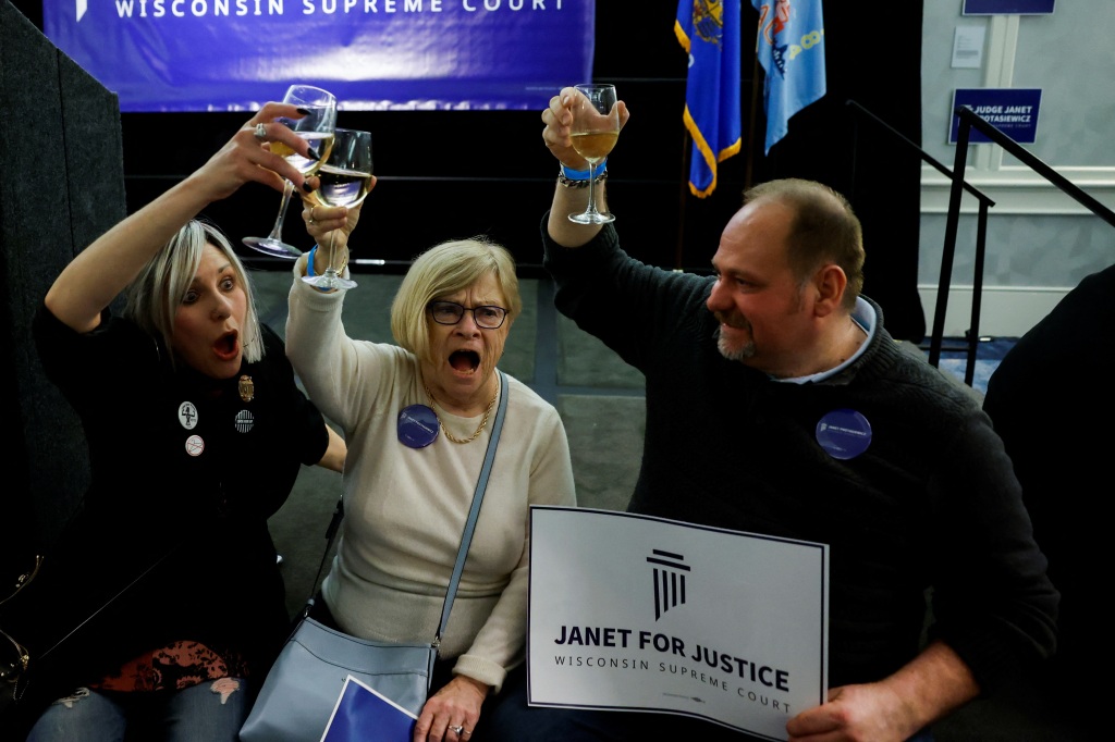 More supporters of Janet Protasiewicz are spotted cheering and celebrating early returns in Milwaukee, Wisconsin on April 4, 2023. 
